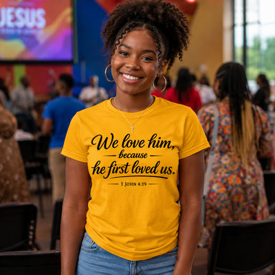 "We Love Him Because He First Loved Us" 1 John 4:19 Christian T-Shirt | Gildan 6400 Soft Style Tee | Faith-Based Bible Verse Shirt for Men & Women